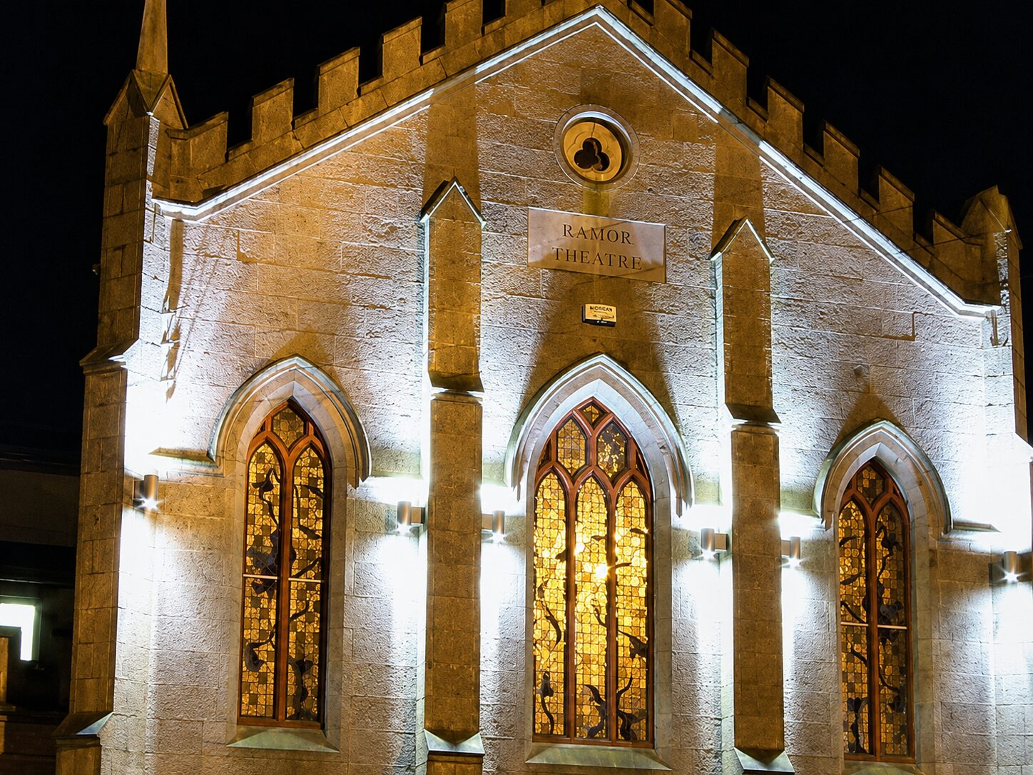 The Ramor Theatre lit at night